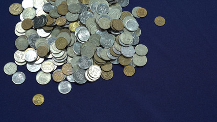 Ruble coins. Pennies. A pile of coins on a blue background. A trifle, rubles