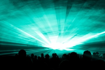 Turquoise laser show nightlife club stage at party people crowd. Luxury entertainment with audience...