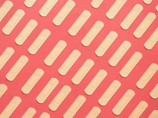 Band aid pattern on red background
