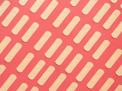 Band Aid Pattern On Red Background