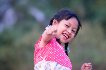Fototapeta premium Portrait of happy smiling asian child girl