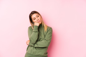 Young caucasian woman posing isolated  who feels sad and pensive, looking at copy space.