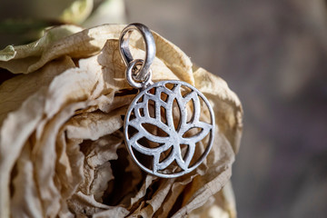 Sterling Silver lotus shape pendant on rose dry blossom