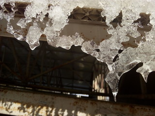 Icicles of a strange surreal shape hang from the roof.