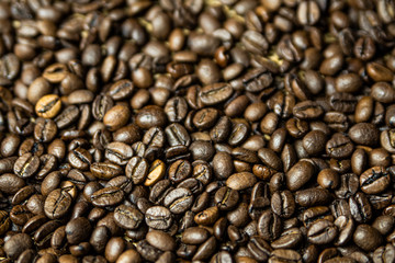 Roasted brown coffee beans. Background coffee texture.