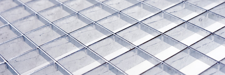 Panoramic image. Industrial galvanized metal grid. Metal background