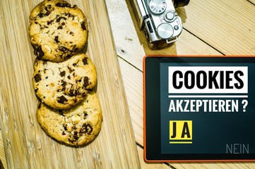 Cookies mit einem Tablet zur Verdeutlichung von Cookie Bannern für Websites mit auf deutsch Cookies akzeptieren JA NEIN in englisch Cookies accept YES NO
