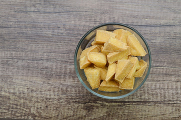 fried tofu bowl on wooden background