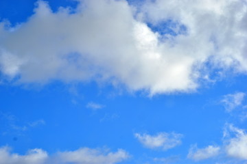 Cumulus clouds against a blue sky