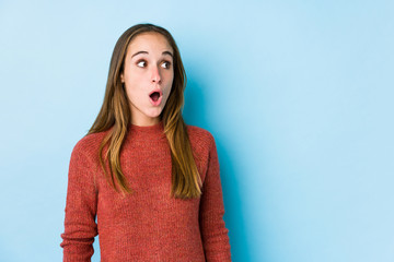 Young caucasian woman posing isolated  being shocked because of something she has seen.