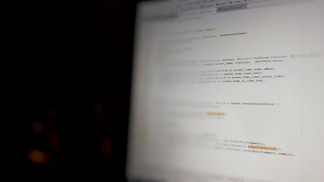 Abstract computer script code. Programming code screen of software developer. Software Programming Work Time.