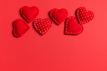 Top view of textile hearts on colorful background. Valentine's day concept with copy space