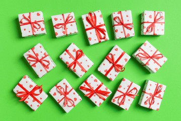 Fototapeta na wymiar Top view of white gift boxes with hearts on colorful background. Valentine's Day concept
