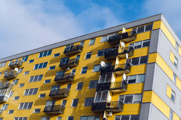 Yellow house and apartments in the daylight