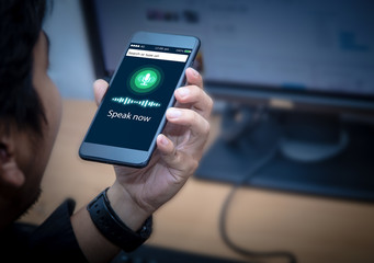 Voice recognition,search technology concept.Close-up of businessman talking on his mobile phone