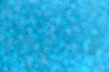 Abstract background with blurred bokeh in blue.