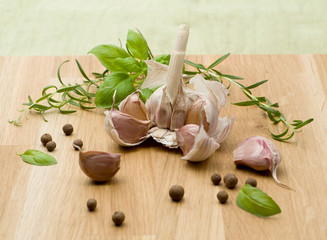 Homegrown tomatoes and garlic on the wooden background