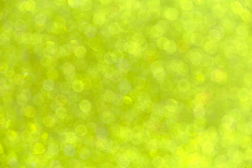 Abstract background with blurred bokeh in yellow.