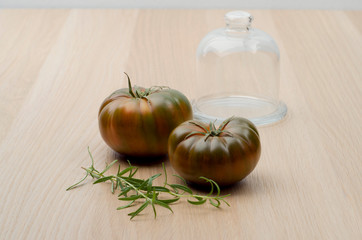 Homegrown tomatoes and garlic on the wooden background