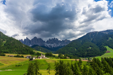 Fototapeta premium Scenic view of Santa Maddalena village church. Dolomites, Val di Funes, Italy.