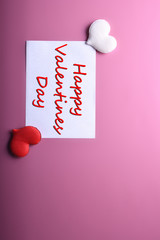 Valentine's day background greeting card love symbols , red decoration with glasses heart roses gifts on pink background. Top view with copy space and text.Flat lay