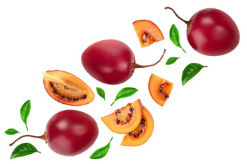 Fresh tamarillo fruit with leaves isolated on white background. Top view. Flat lay