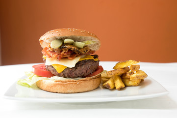 Big burguer over white background. Meal