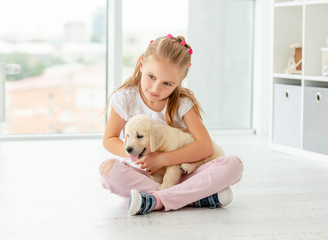 Nice girl holding puppy