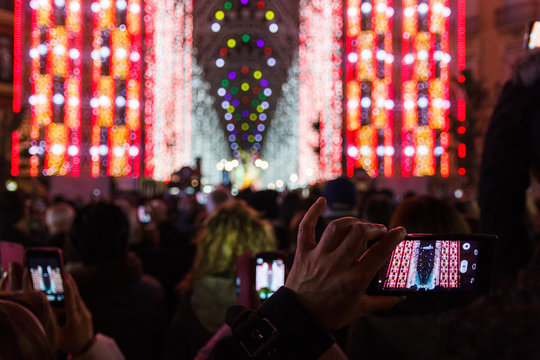 Fallas of Valencia, Spain. People photograph a typical light show.