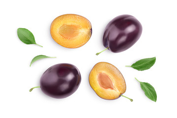 fresh purple plum and half with leaves isolated on white background with clipping path and full...