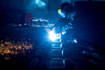 welder works at the factory as a welding machine