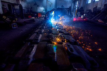 welder works at the factory as a welding machine