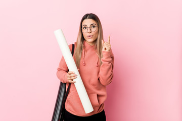 Young woman studying architecture having some great idea, concept of creativity.