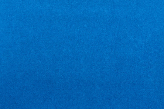 Blue background. Velvet paper texture.