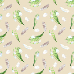 Seamless watercolor pattern with snowdrops, easter eggs and beautiful feathers. Illustration fabric texture. Design concept on a blue  background.