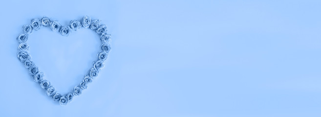 Beautiful heart made roses in a classic blue color on a blue background. I love you. Greeting card.Valentine's day.Woman's day.isolated