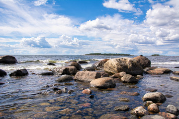 Fototapeta na wymiar Coastal view of Isosaari island, stones on the shore and Gulf of Finland, Helsinki, Finland