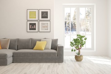 Stylish room in white color with sofa and winter landscape in window. Scandinavian interior design. 3D illustration