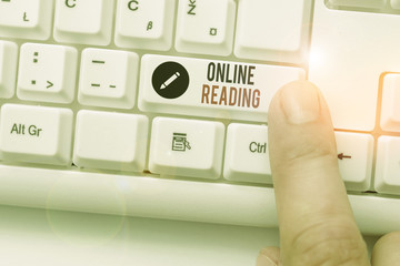 Writing note showing Online Reading. Business concept for process of extracting meaning is in a...