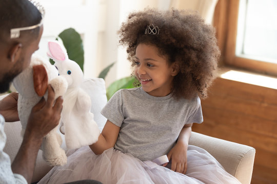 African Daughter Holding Soft Animals Toys Acting Out Fun Performance