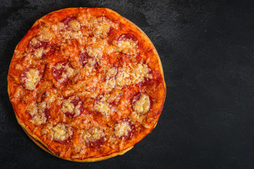 pizza salami sausages (tomato sauce, cheese, meat). food background. top view. copy space