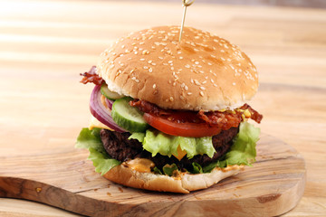 Tasty fresh meat burgers with salad and cheese. Homemade angus burger.