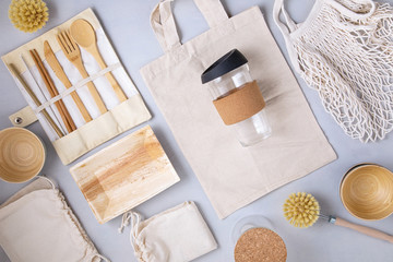 Fototapeta na wymiar Zero waste kit. Set of eco friendly bamboo cutlery, mesh cotton bag, reusable coffee tumbler and water bottle. Sustainable, ethical, plastic free lifestyle.