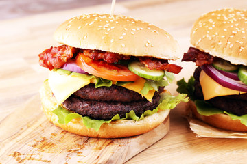 Tasty fresh meat burgers with salad and cheese. Homemade angus burger.