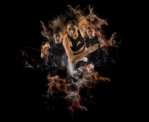 Men and woman running on smoke background. Mixed image