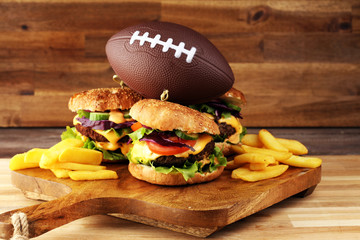 Tasty fresh meat burgers with salad and cheese. Homemade angus burger. Great for Bowl football Game...