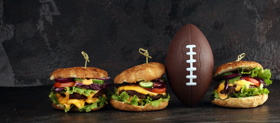 Tasty fresh meat burgers with salad and cheese. Homemade angus burger. Great for Bowl football Game angus burger