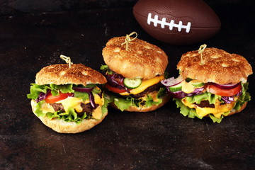 Tasty fresh meat burgers with salad and cheese. Homemade angus burger. Great for Bowl football Game angus burger