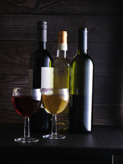 two glasses with red and white wine