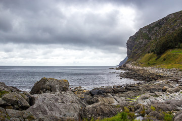 Fototapeta na wymiar mountains and rocks by the sea on a rainy day in Norway